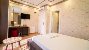 Postel nebo postele na pokoji v ubytování DYMAR HOTEL