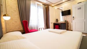 Postel nebo postele na pokoji v ubytování DYMAR HOTEL