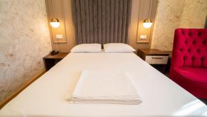 Postel nebo postele na pokoji v ubytování DYMAR HOTEL