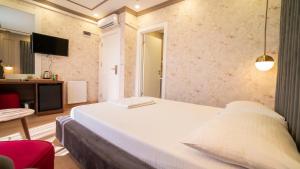 Postel nebo postele na pokoji v ubytování DYMAR HOTEL