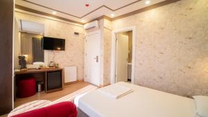 Postel nebo postele na pokoji v ubytování DYMAR HOTEL