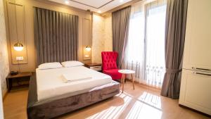 Postel nebo postele na pokoji v ubytování DYMAR HOTEL