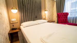 Postel nebo postele na pokoji v ubytování DYMAR HOTEL