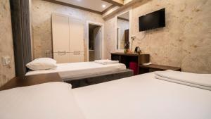 Postel nebo postele na pokoji v ubytování DYMAR HOTEL