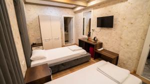 Postel nebo postele na pokoji v ubytování DYMAR HOTEL
