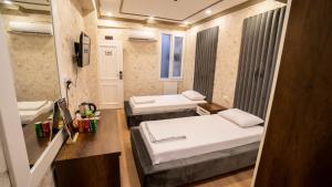 Postel nebo postele na pokoji v ubytování DYMAR HOTEL