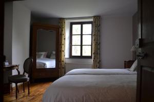 La Renardière - Chanly tesisinde bir odada yatak veya yataklar