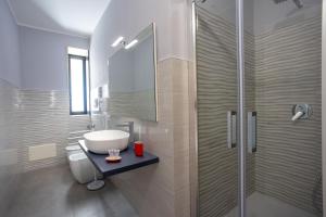 a bathroom with a sink and a shower at Villa Altomare in Otranto +56 photos