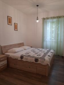 Postel nebo postele na pokoji v ubytování Apartments Car