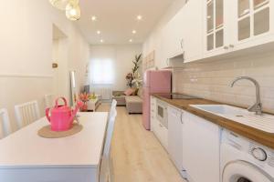 a kitchen with a sink and a pink pot on a counter at Old Town IV by Next Stop Bilbao in Bilbao +16 photos