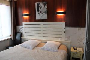 Postel nebo postele na pokoji v ubytování Hotel du Gambrinus