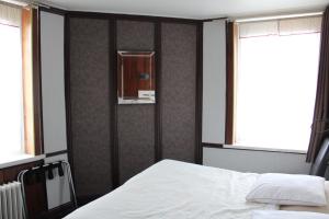 Postel nebo postele na pokoji v ubytování Hotel du Gambrinus