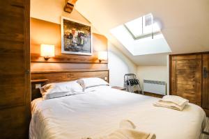 Ένα ή περισσότερα κρεβάτια σε δωμάτιο στο Private penthouse 2-bed Apartment, ski in and out in 5* Flaine Residence +30 φωτογραφίες