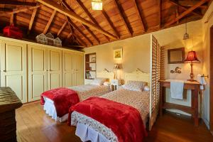 En eller flere senge i et værelse på Casa Ana