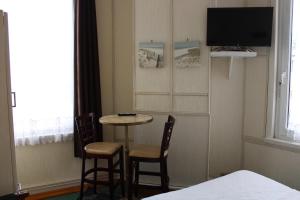 TV a/nebo společenská místnost v ubytování Hotel du Gambrinus