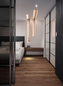 a bedroom with a bed and a window at Ivis 4 Boutique Hotel in Athens