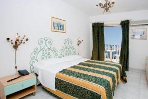 Katil atau katil-katil dalam bilik di Hotel da Peppe