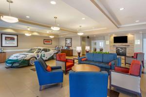 a lobby with a car parked in a car showroom at Comfort Inn & Suites Tooele-Salt Lake City in Tooele