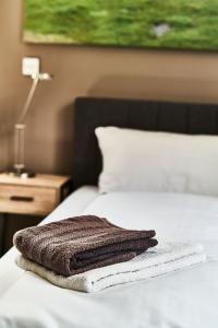 Postel nebo postele na pokoji v ubytování PRIMERA Zimmer mit Gemeinschaftsbad