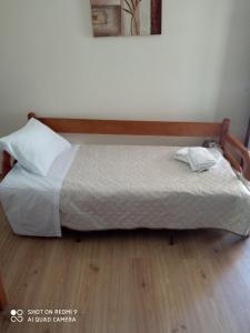 A bed or beds in a room at Vacations in Corfu-Antiperni by CorfuEscapes