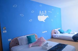Letto o letti in una camera di Nandian Homestay