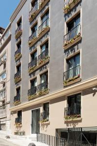 an apartment building with flower boxes on the balconies at Home Of Istanbul in Istanbul