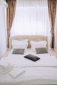 Ένα ή περισσότερα κρεβάτια σε δωμάτιο στο Class DeLuxe Apartments