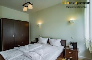 Posteľ alebo postele v izbe v ubytovaní Baltic Apartments - Bałtycka