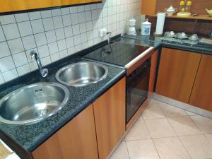 Kuchyň nebo kuchyňský kout v ubytování My House Suite
