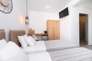 Telewizja i/lub zestaw kina domowego w obiekcie Kalisperis Hotel