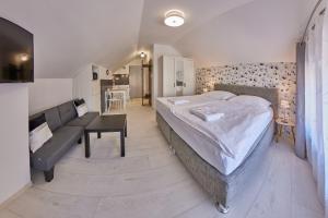 Posteľ alebo postele v izbe v ubytovaní Apartmány Malen