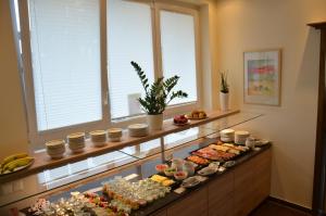 a display case with a bunch of food on it at Flair Hotel am Rosenhügel - Garni in Cochem