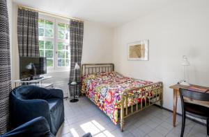 Postel nebo postele na pokoji v ubytování Hotel Hofgarten Luzern