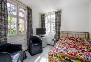 Postel nebo postele na pokoji v ubytování Hotel Hofgarten Luzern