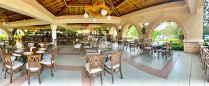a large outdoor dining area with tables and chairs at Duni Belleville - All Inclusive in Sozopol