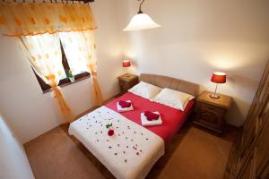 Postel nebo postele na pokoji v ubytování Apartman Sofija