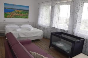 A bed or beds in a room at Apartmány Pemag Mikulov