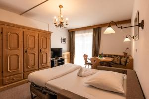 Łóżko lub łóżka w pokoju w obiekcie Hotel Hochfilzer