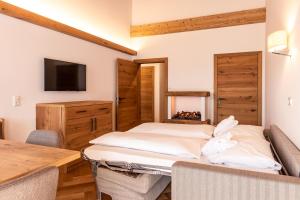 Łóżko lub łóżka w pokoju w obiekcie Hotel Hochfilzer