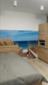 Łóżko lub łóżka w pokoju w obiekcie Apartamenty Bulwar Nadmorski, Ustka