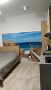 Łóżko lub łóżka w pokoju w obiekcie Apartamenty Bulwar Nadmorski, Ustka