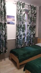 Łóżko lub łóżka w pokoju w obiekcie Apartamenty Bulwar Nadmorski, Ustka
