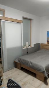 Łóżko lub łóżka w pokoju w obiekcie Apartamenty Bulwar Nadmorski, Ustka