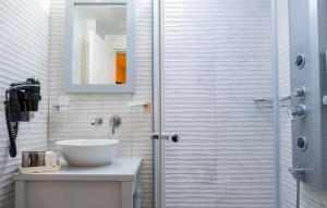 a bathroom with a sink and a shower at PROVENCE MANSİON ALAÇATI in Alacati