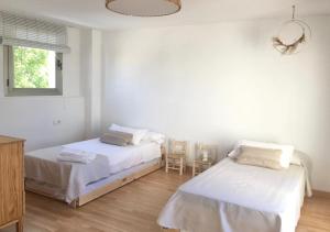 Postel nebo postele na pokoji v ubytování Casa2patis + 37 fotografií