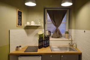 Η κουζίνα ή μικρή κουζίνα στο Suite Lisa +13 φωτογραφίες