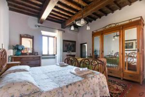 Posteľ alebo postele v izbe v ubytovaní Villa privata con piscina firenze chianti + 37 fotografií
