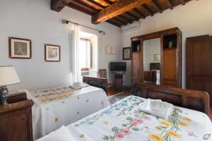 Posteľ alebo postele v izbe v ubytovaní Villa privata con piscina firenze chianti