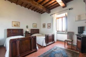 Posteľ alebo postele v izbe v ubytovaní Villa privata con piscina firenze chianti