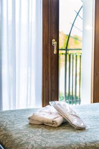 Postel nebo postele na pokoji v ubytování Hotel Da Gigi